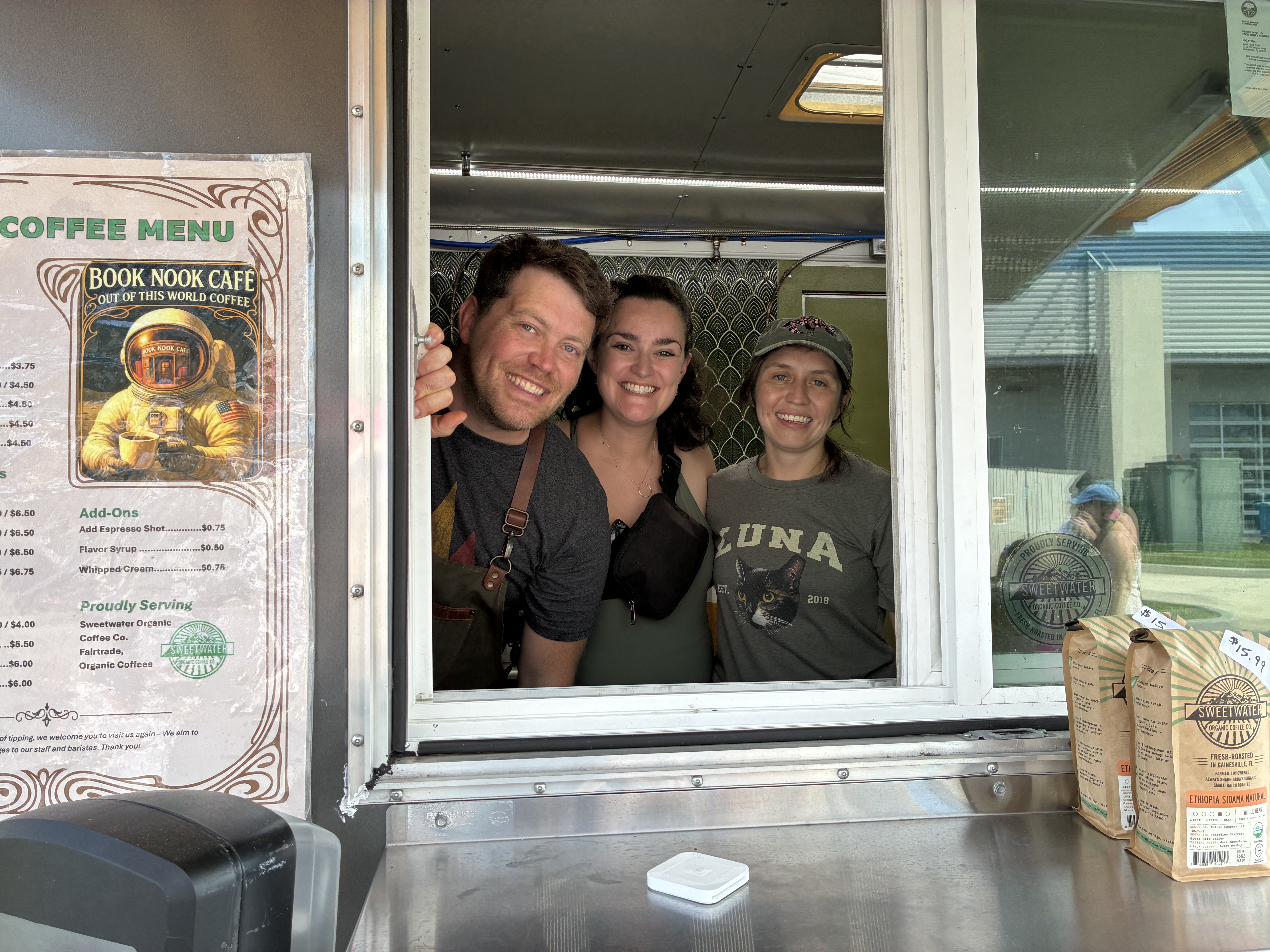 The Book Nook Cafe team serving from the trailer window in Gainesville.